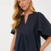 Navy Finley Flutter Sleeve Top -Loeffler Cloth Shop fN3YcDaifB2gLpeczGQWKLYRym3L4Xlb 1